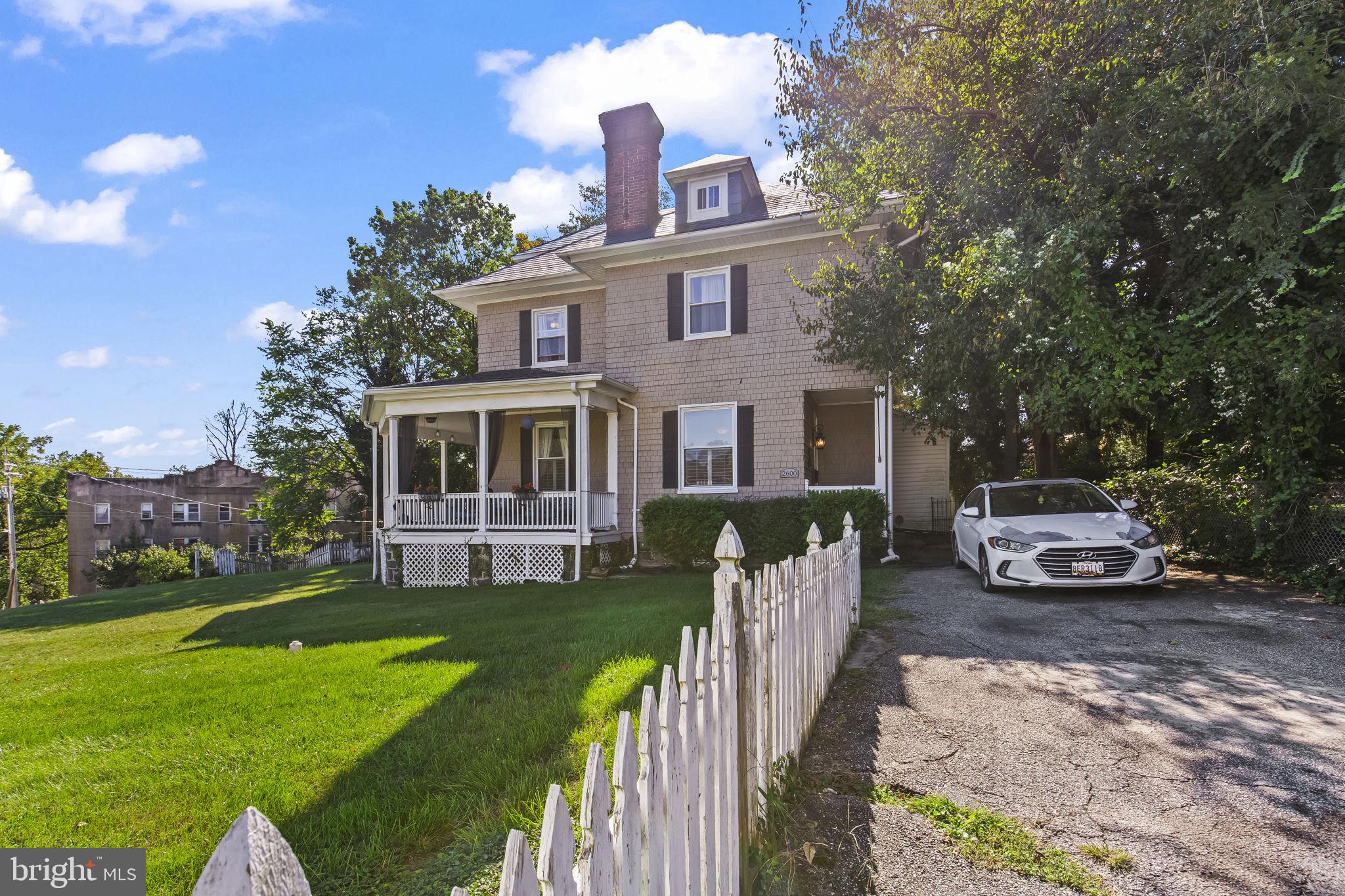2600 Queen Anne Road Baltimore, MD 21216 - Photo 25 of 29 a front view of a house with garden