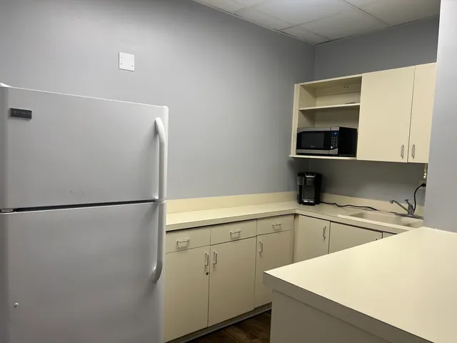 a white refrigerator freezer sitting inside of a kitchen