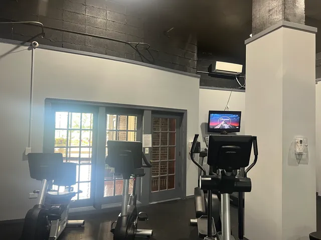 a view of a livingroom with furniture and windows