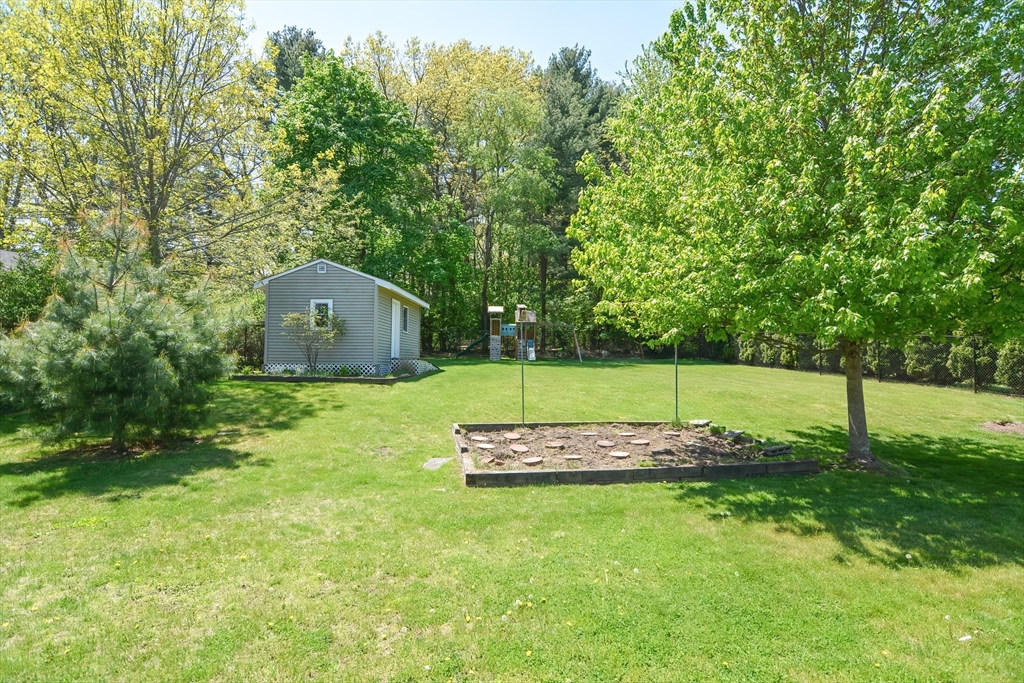 19 Daniels Road Framingham, MA 01701 - Photo 3 of 40 a view of a house with a yard
