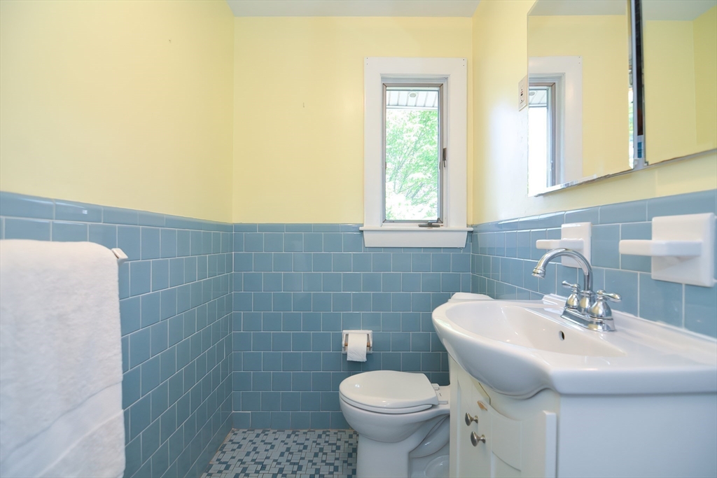 19 Daniels Road Framingham, MA 01701 - Photo 32 of 40 a bathroom with a sink a toilet and mirror