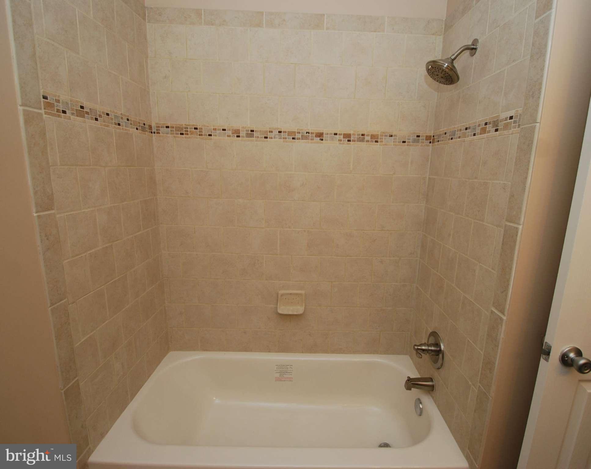 23501 Slidell Road Boyds, MD 20841 - Photo 14 of 27 a close up of a bathtub in a bathroom