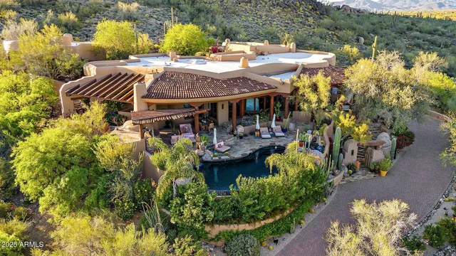 a view of a patio with table and chairs and potted plants