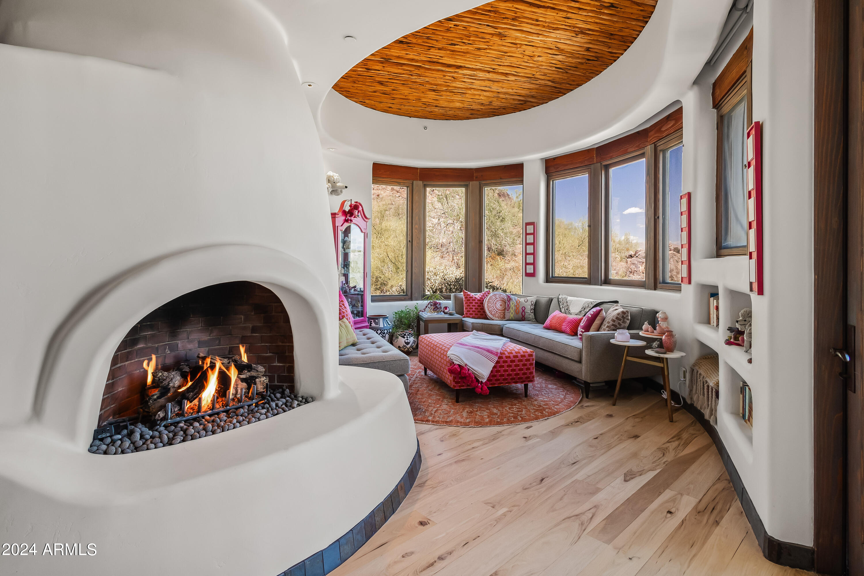 8300 East Dixileta Drive, Unit 263 Scottsdale, AZ 85266 - Photo 23 of 53 a living room with furniture and a fireplace