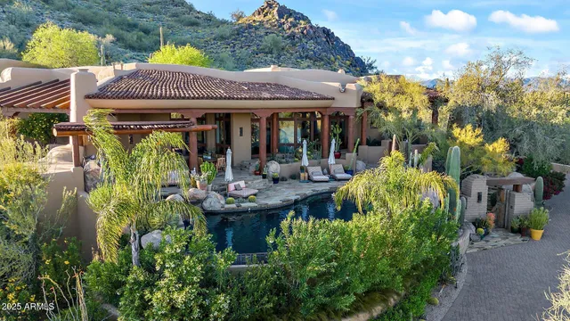a view of a house with patio and garden