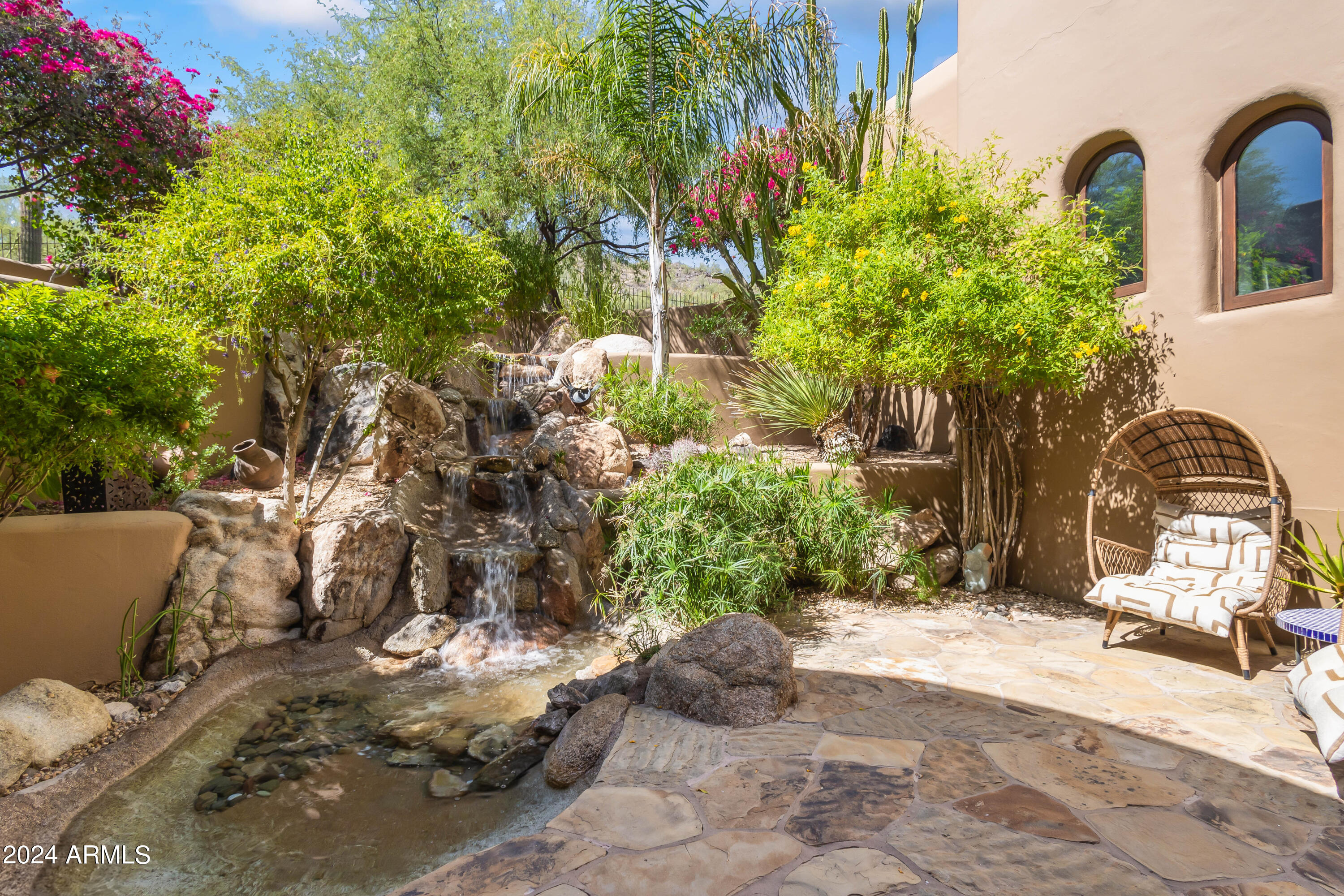 8300 East Dixileta Drive, Unit 263 Scottsdale, AZ 85266 - Photo 42 of 53 a view of a couches in front of a house