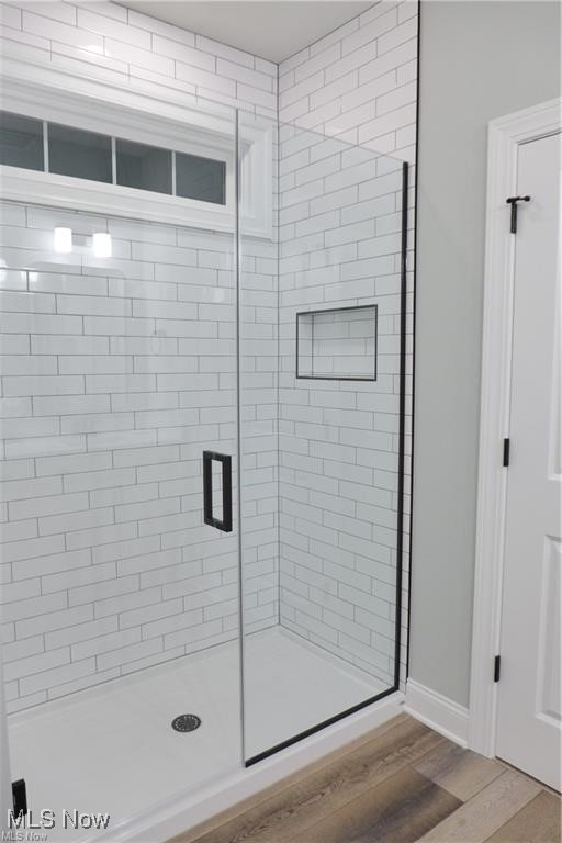 32028 Chestnut Ridge Road North Ridgeville, OH 44039 - Photo 25 of 39 Bathroom featuring a shower with shower door and hardwood / wood-style flooring