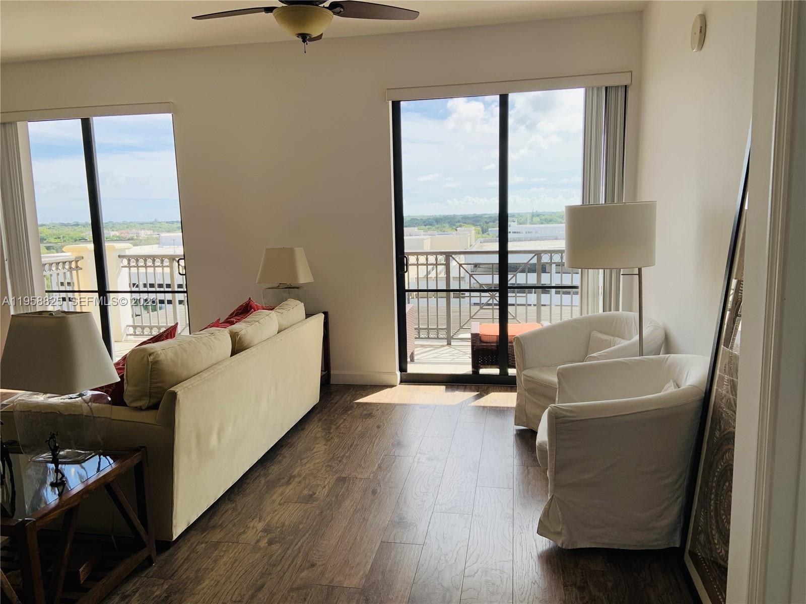 8395 Southwest 73rd Avenue, Unit 704 Miami, FL 33143 - Photo 14 of 47 a living room with furniture and a window