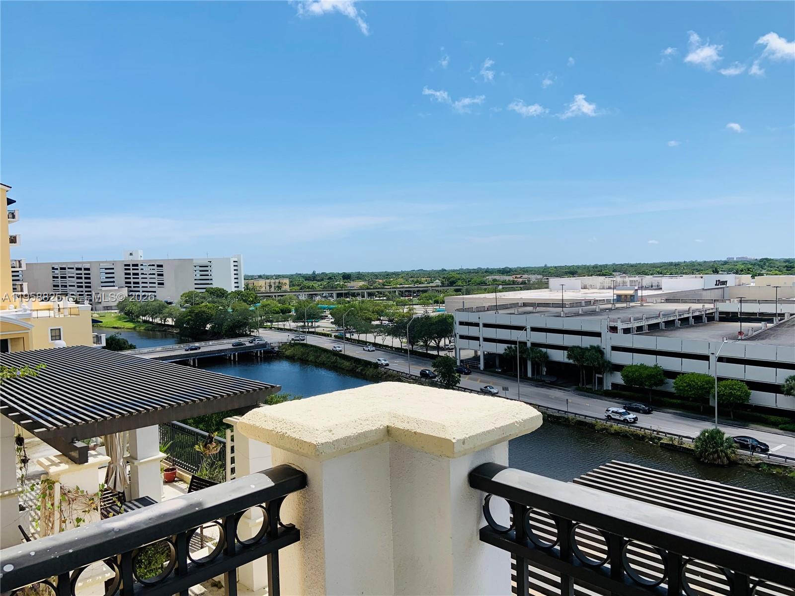 8395 Southwest 73rd Avenue, Unit 704 Miami, FL 33143 - Photo 16 of 47 a view of a balcony with furniture