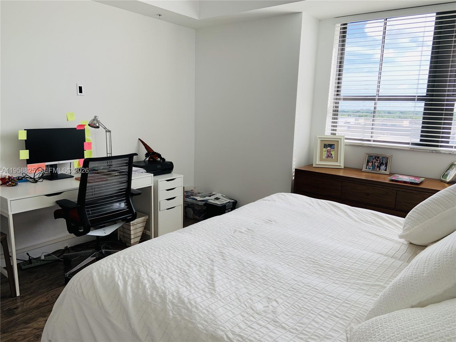 8395 Southwest 73rd Avenue, Unit 704 Miami, FL 33143 - Photo 19 of 47 a bedroom with a bed and a window