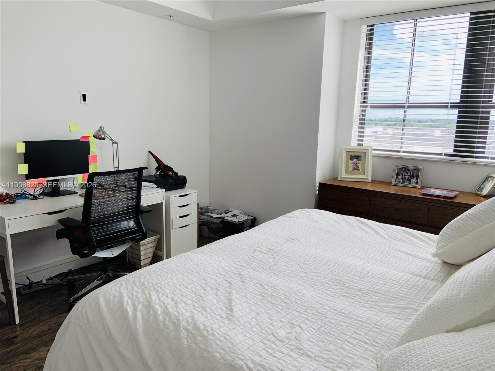 8395 Southwest 73rd Avenue, Unit 704 Miami, FL 33143 - Photo 20 of 47 a bedroom with a bed and a window