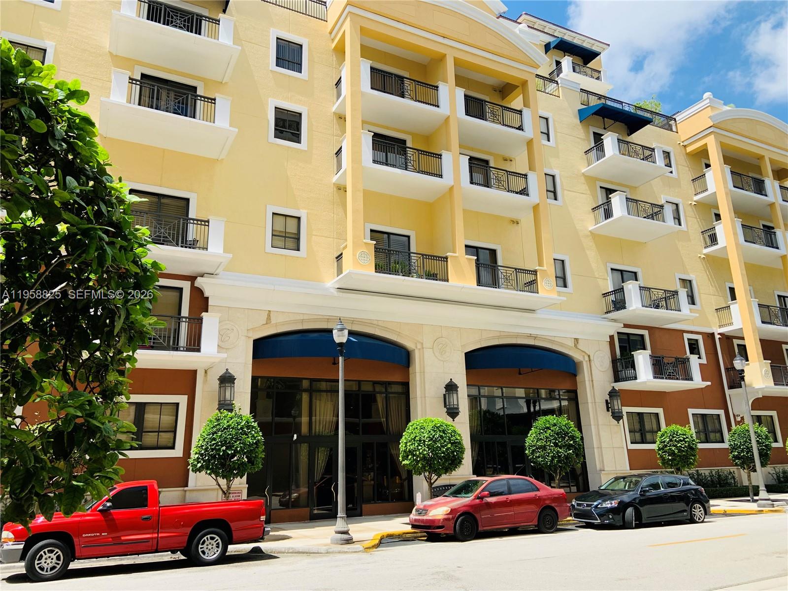 8395 Southwest 73rd Avenue, Unit 704 Miami, FL 33143 - Photo 2 of 47 a cars parked in front of a building