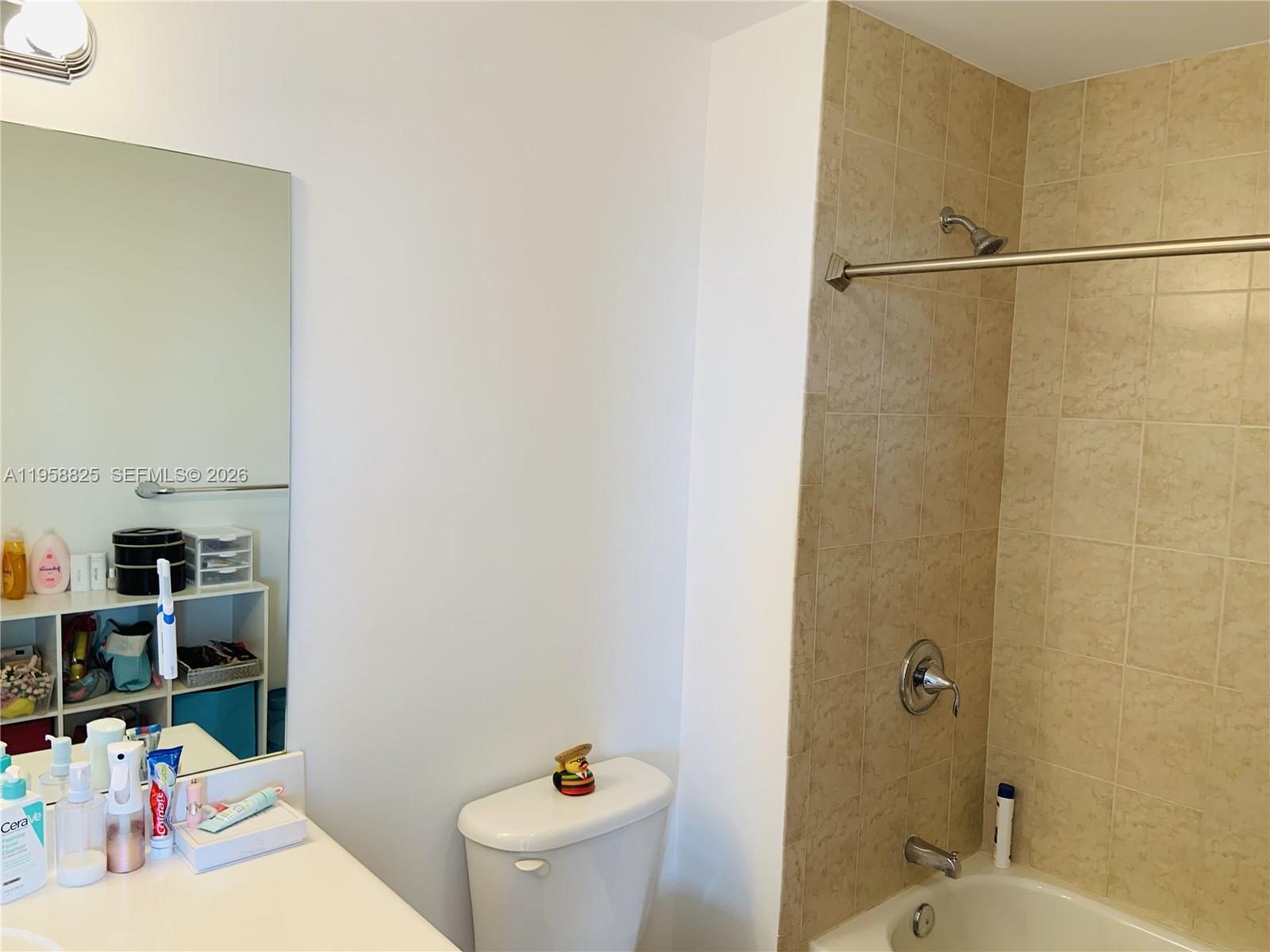 8395 Southwest 73rd Avenue, Unit 704 Miami, FL 33143 - Photo 28 of 47 a bathroom with a sink and a toilet