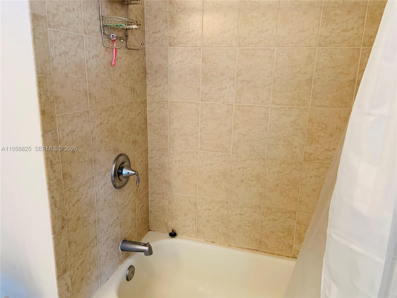 8395 Southwest 73rd Avenue, Unit 704 Miami, FL 33143 - Photo 29 of 47 a bathroom with a shower