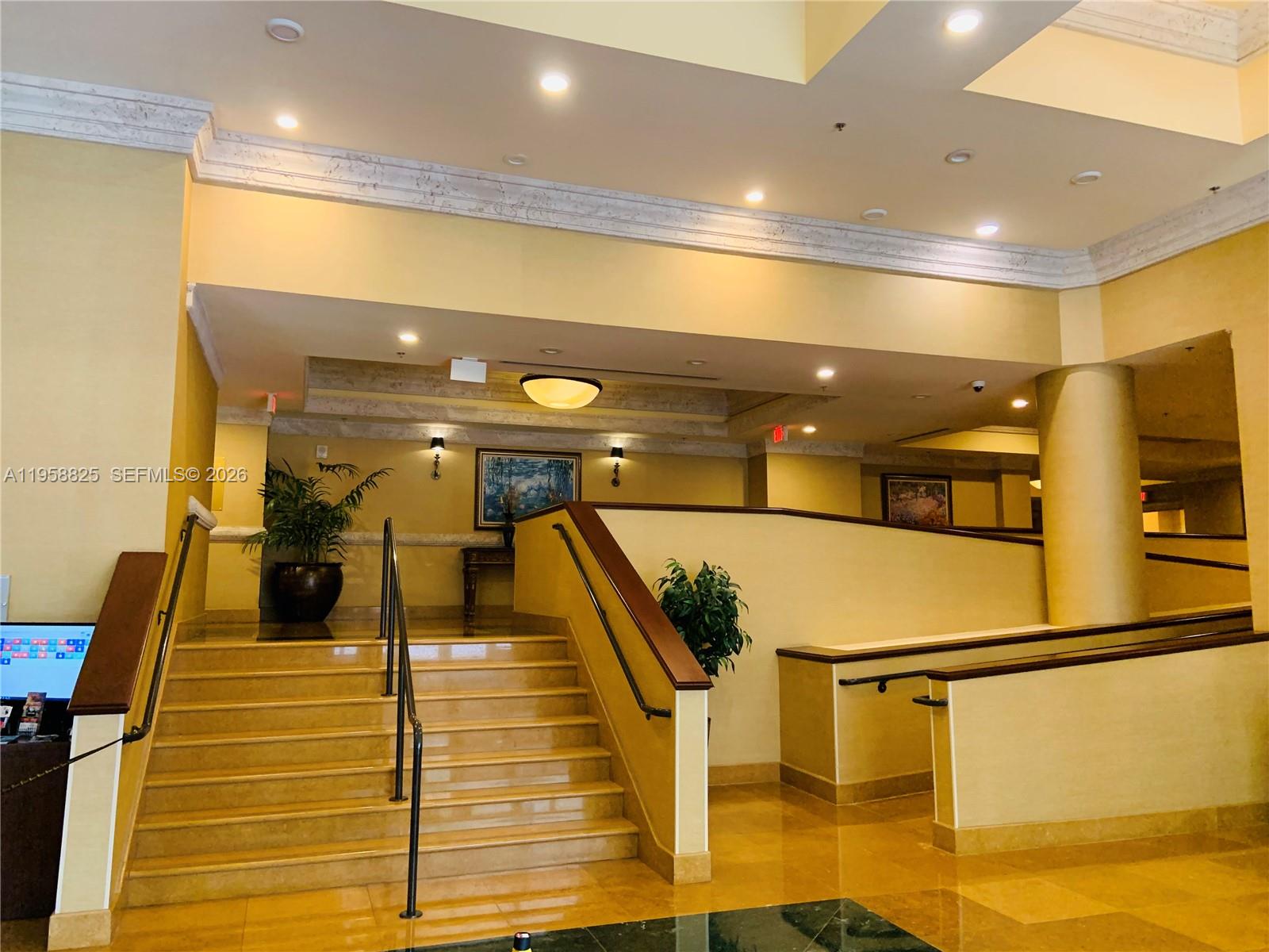 8395 Southwest 73rd Avenue, Unit 704 Miami, FL 33143 - Photo 37 of 47 a lobby with gym equipment