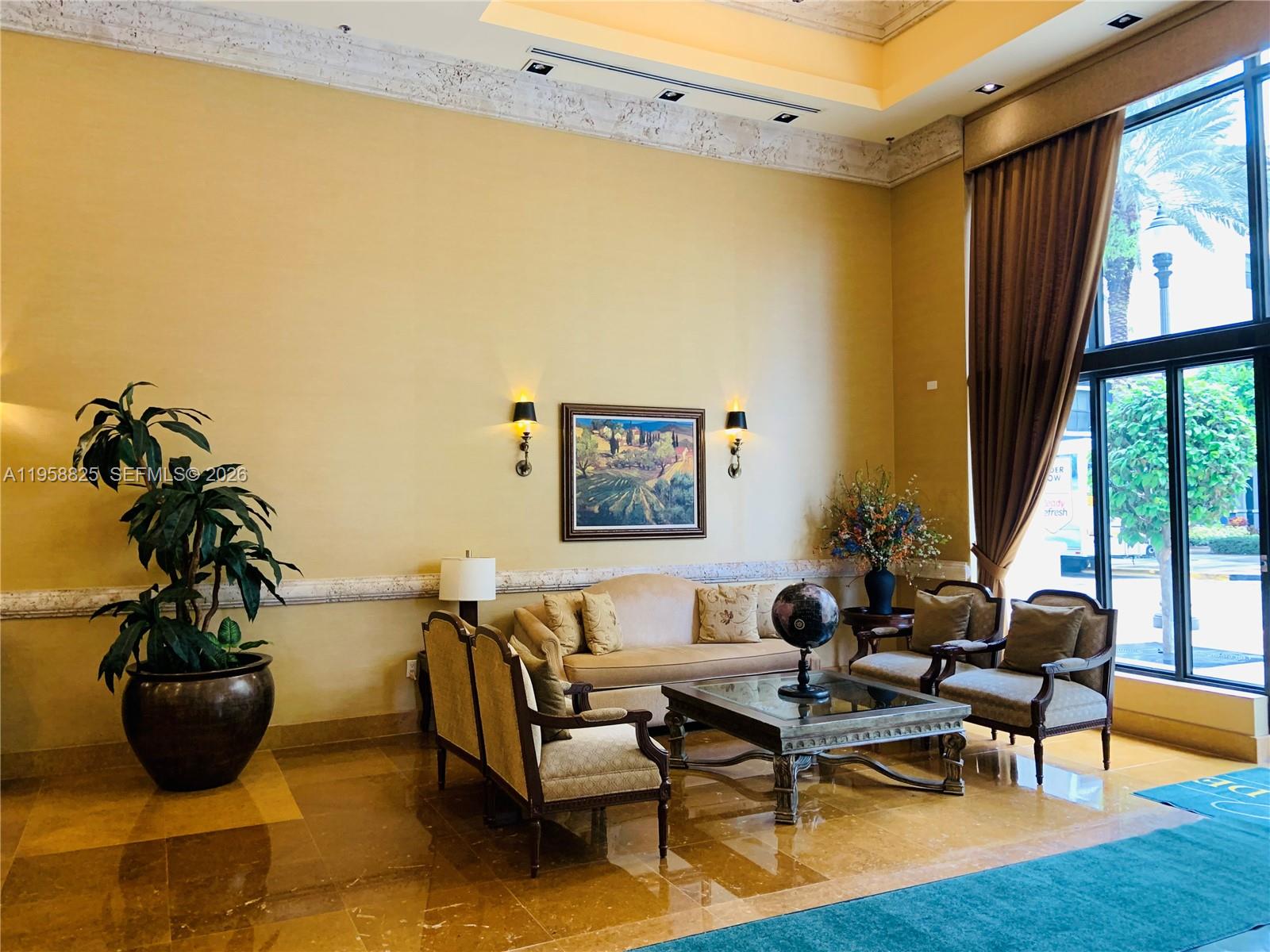 8395 Southwest 73rd Avenue, Unit 704 Miami, FL 33143 - Photo 38 of 47 a living room with furniture and a potted plant