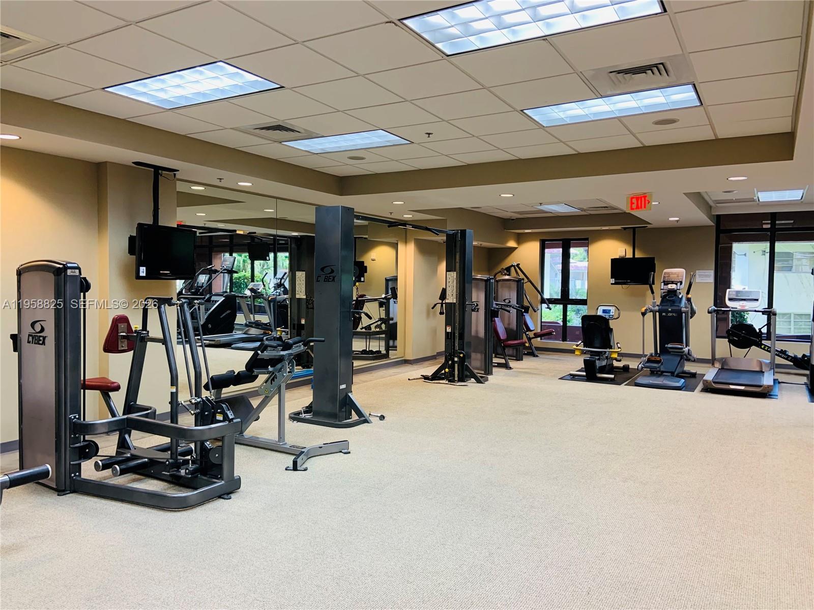8395 Southwest 73rd Avenue, Unit 704 Miami, FL 33143 - Photo 43 of 47 a view of a room with gym equipment