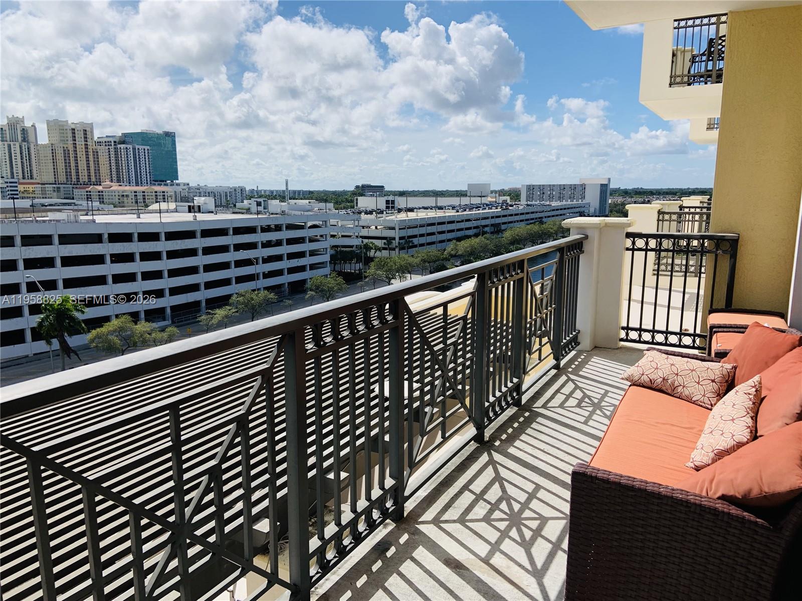 8395 Southwest 73rd Avenue, Unit 704 Miami, FL 33143 - Photo 5 of 47 a view of a balcony with wooden floor