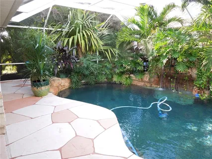 a view of swimming pool with a garden