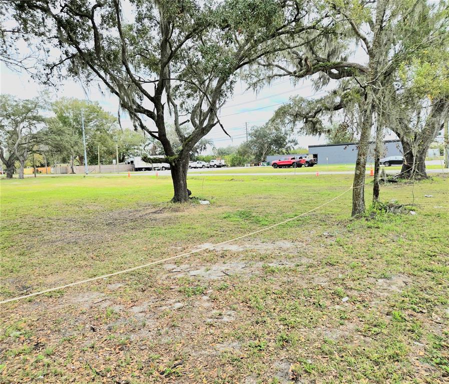 3416 Flat Road Lakeland, FL 33801 - Photo 2 of 9 a view of yard with swimming pool and trees