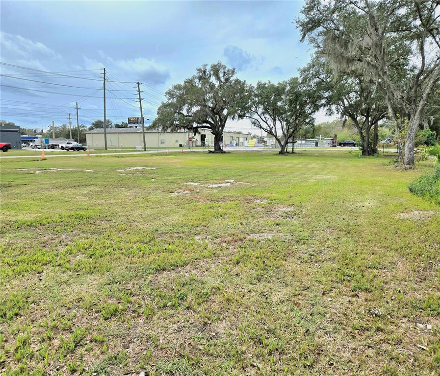 3416 Flat Road Lakeland, FL 33801 - Photo 4 of 9 a view of a grassy field with benches