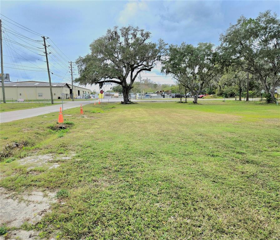 3416 Flat Road Lakeland, FL 33801 - Photo 8 of 9 a view of a swimming pool with an outdoor space and seating area