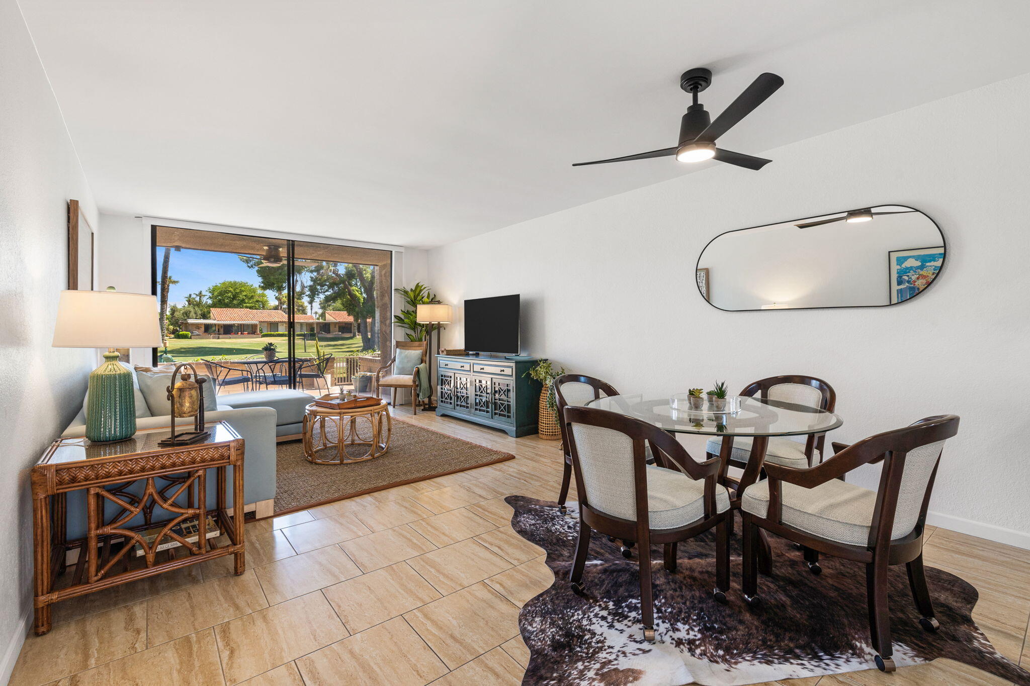 56 Majorca Drive Rancho Mirage, CA 92270 - Photo 11 of 33 a dining room with furniture and a wooden floor