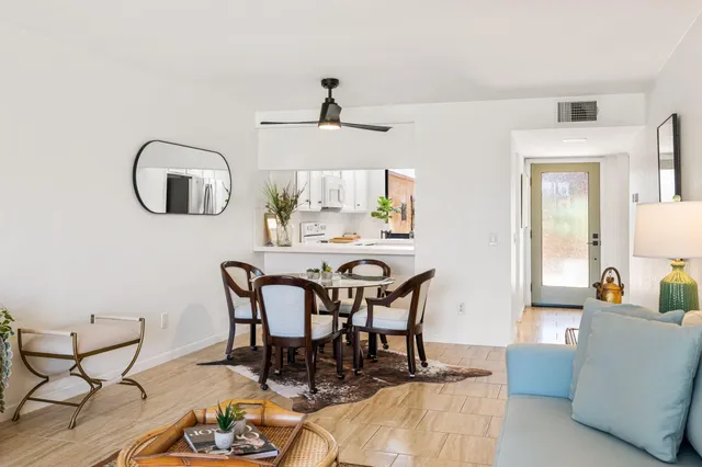 a dining room with furniture and window