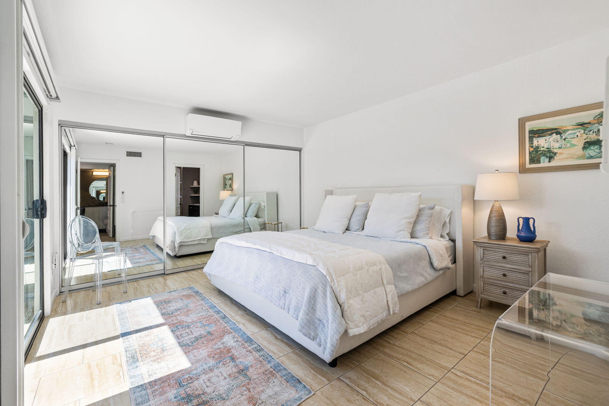 56 Majorca Drive Rancho Mirage, CA 92270 - Photo 21 of 33 a bedroom with a bed and a large mirror