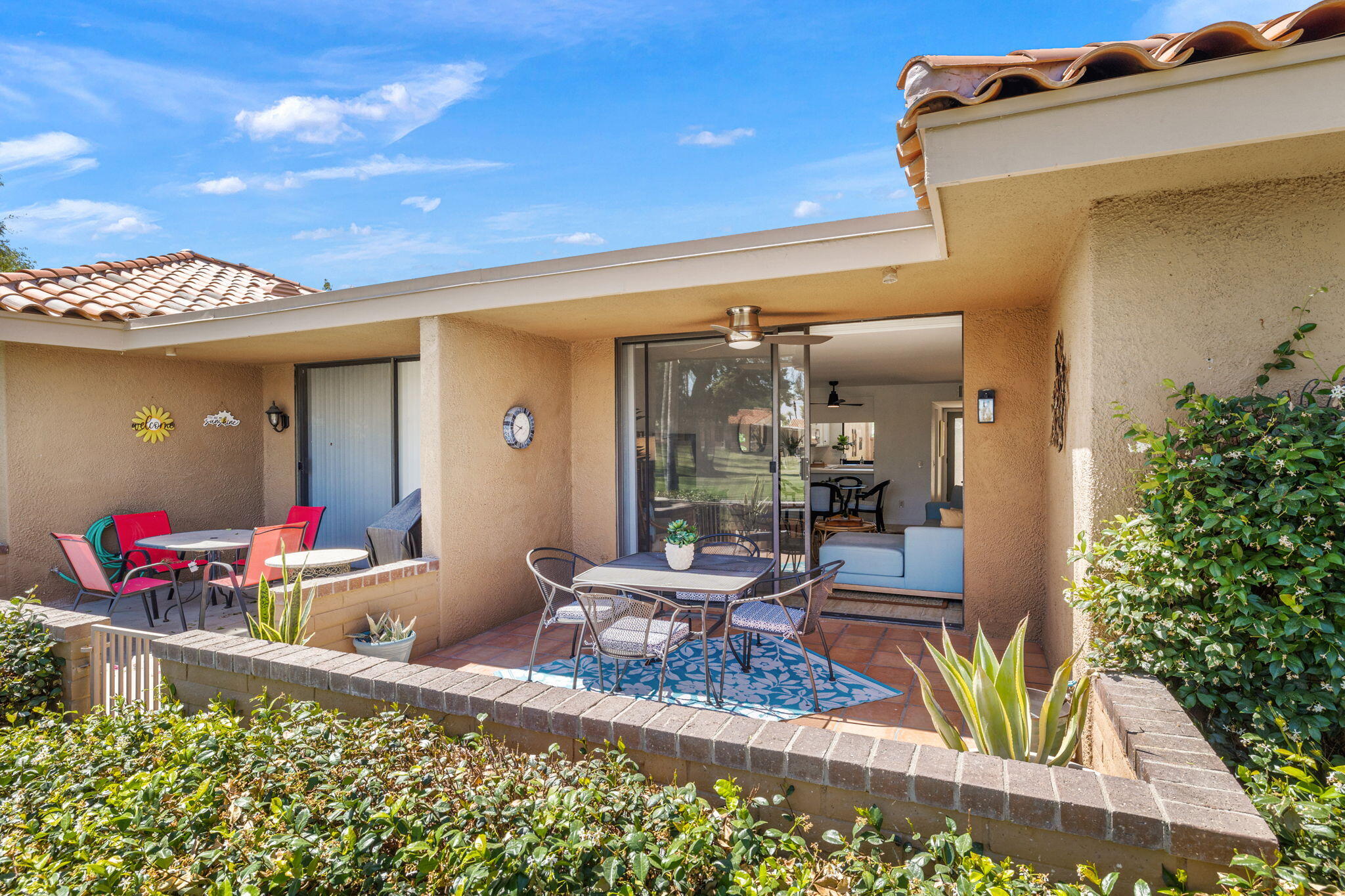 56 Majorca Drive Rancho Mirage, CA 92270 - Photo 27 of 33 a living room with furniture and a potted plant
