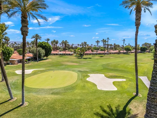 a view of a swimming pool with a yard