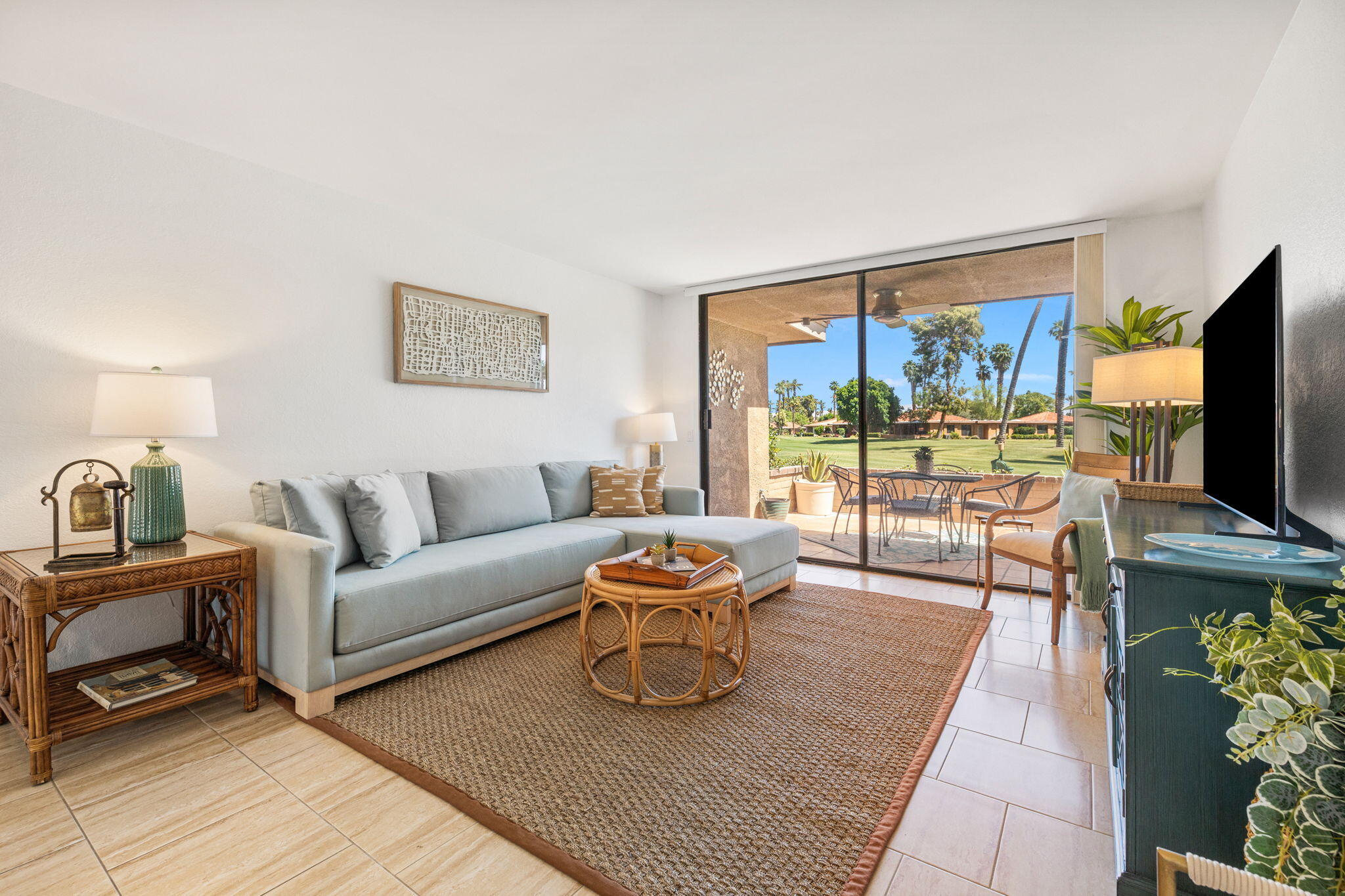 56 Majorca Drive Rancho Mirage, CA 92270 - Photo 3 of 33 a living room with furniture and a flat screen tv