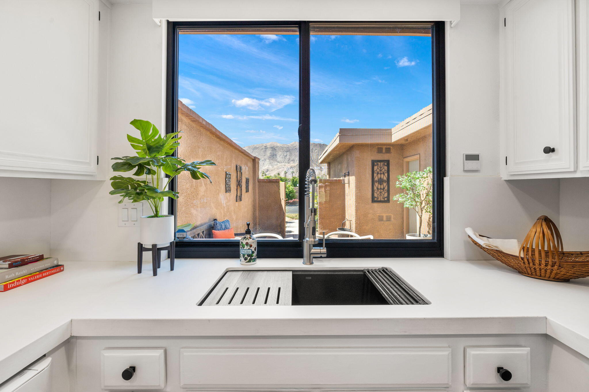 56 Majorca Drive Rancho Mirage, CA 92270 - Photo 5 of 33 a kitchen view of a kitchen counter top a stove and a wooden floor
