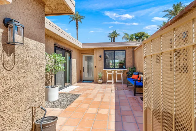 a balcony view with a seating space