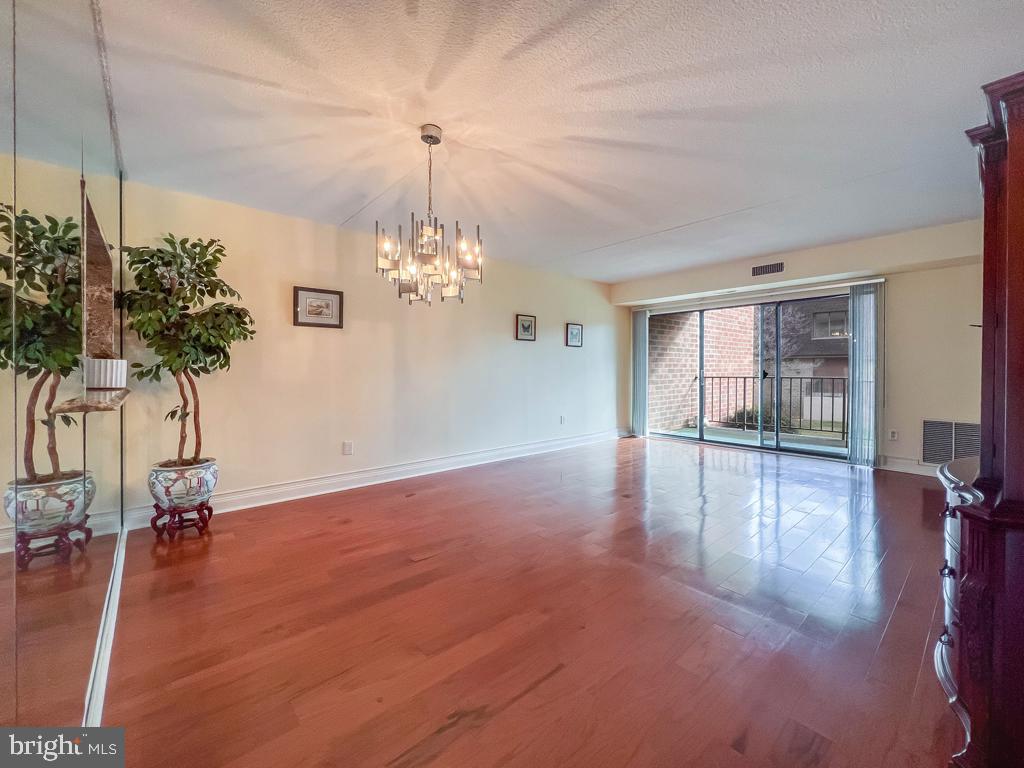 6204 Delaire Landing Road, Unit 204 Philadelphia, PA 19114 - Photo 13 of 40 a view of a livingroom with a chandelier
