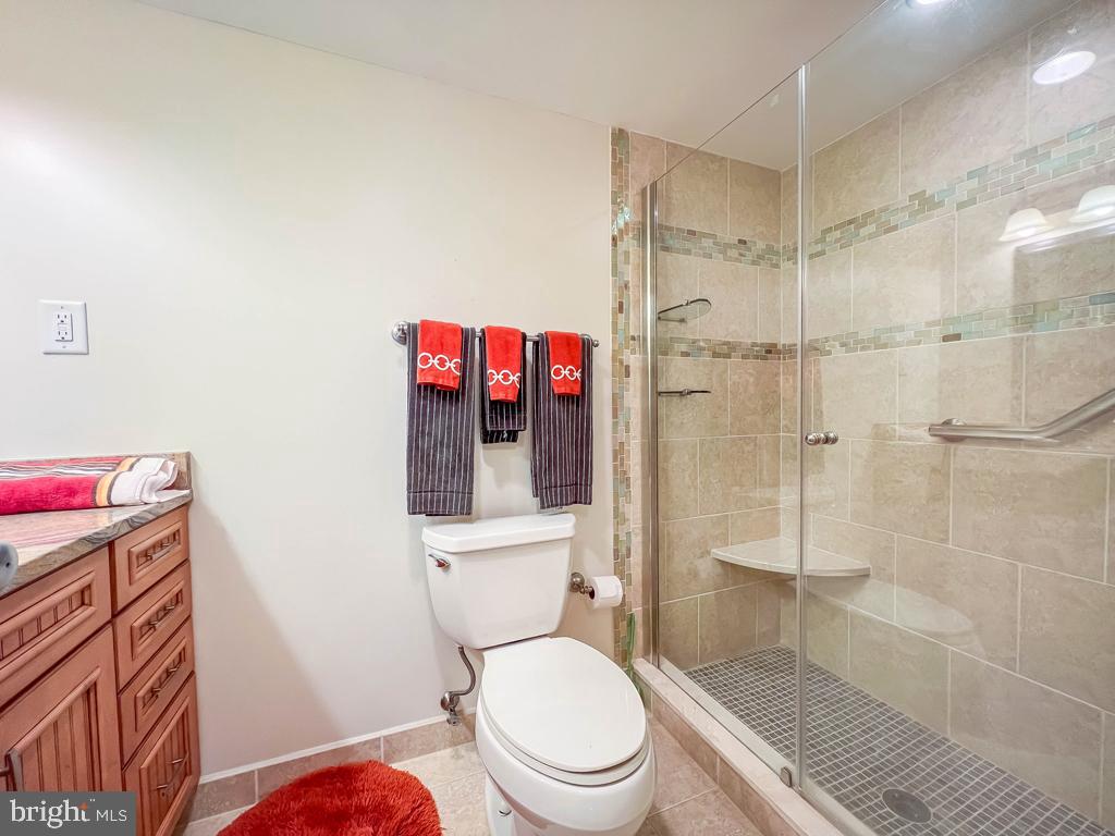 6204 Delaire Landing Road, Unit 204 Philadelphia, PA 19114 - Photo 25 of 40 a white toilet sitting next to a bathroom sink