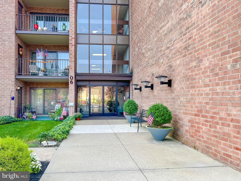 6204 Delaire Landing Road, Unit 204 Philadelphia, PA 19114 - Photo 3 of 40 a view of a building with a garden