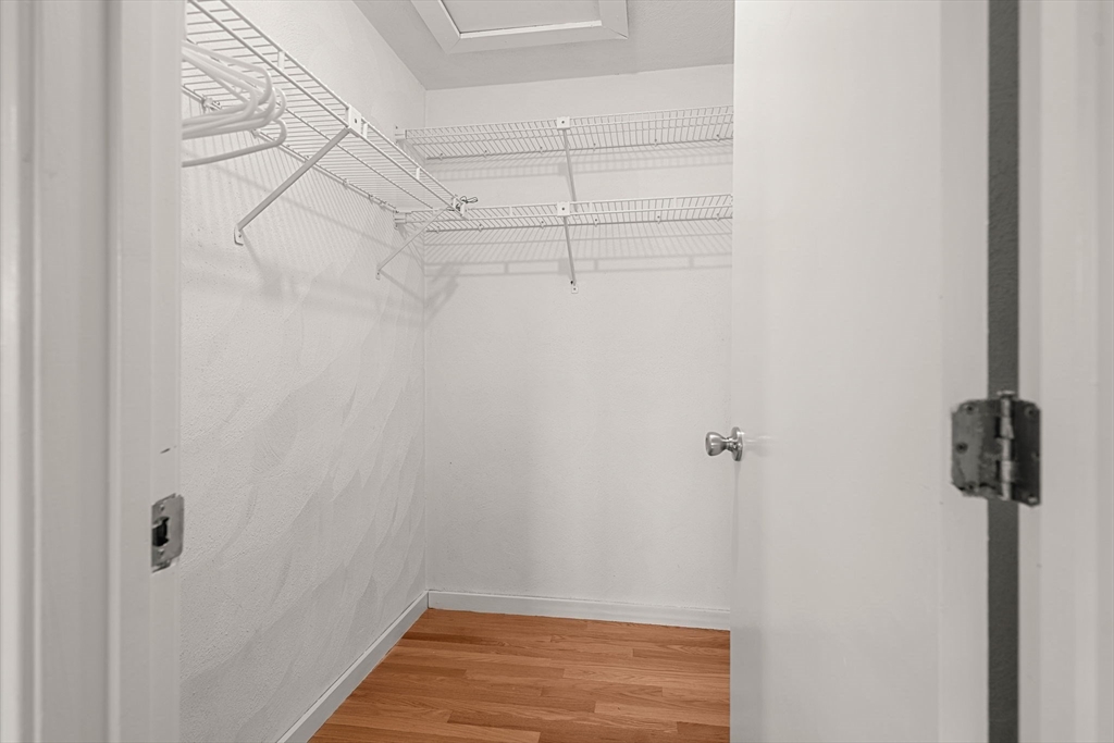 290 Apache Way, Unit 290 Tewksbury, MA 01876 - Photo 21 of 29 a view of a room with racks on the wall