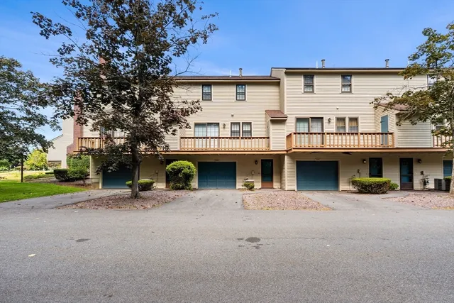 a view of a car park in front of house