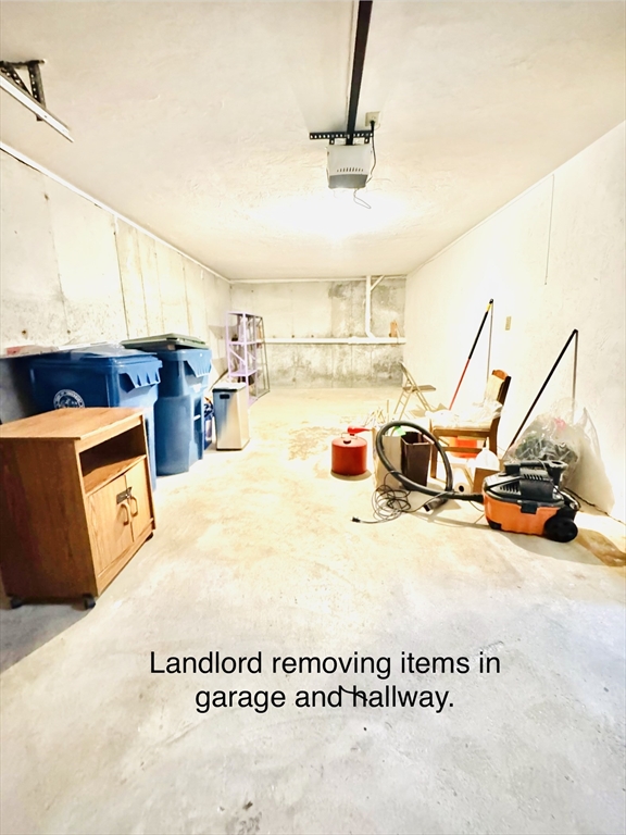 290 Apache Way, Unit 290 Tewksbury, MA 01876 - Photo 27 of 29 a view of a kitchen with a stove and a chandelier