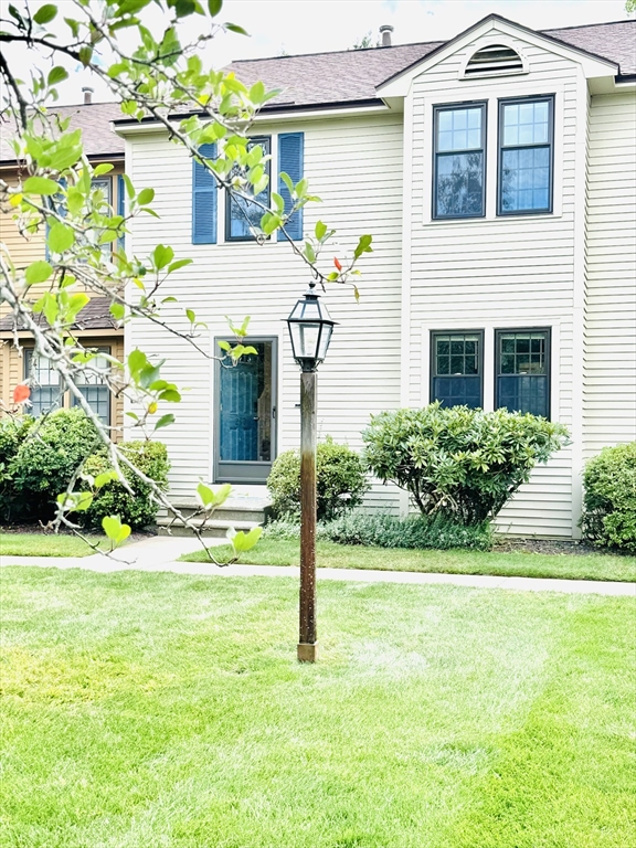 290 Apache Way, Unit 290 Tewksbury, MA 01876 - Photo 29 of 29 a view of a house with pool and garden