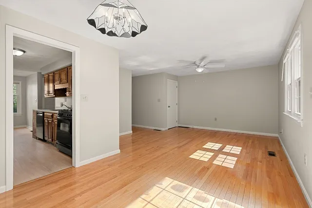a view of livingroom with hardwood floor and a ceiling fan