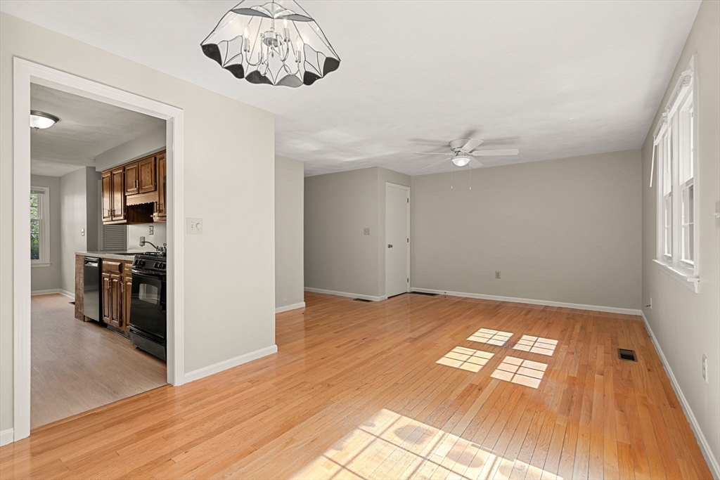290 Apache Way, Unit 290 Tewksbury, MA 01876 - Photo 5 of 29 a view of livingroom with hardwood floor and a ceiling fan