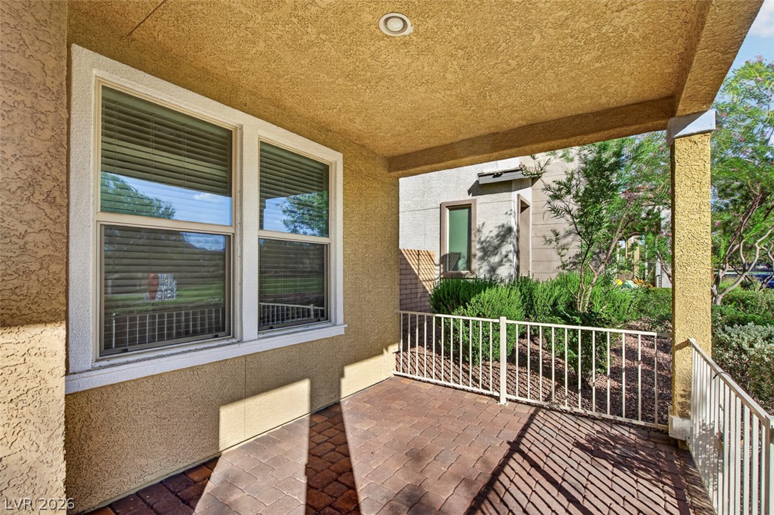 1100 East Sunset Road Henderson, NV 89011 - Photo 5 of 58 An inviting covered patio offers a private outdoor space, perfect for tranquil relaxation.