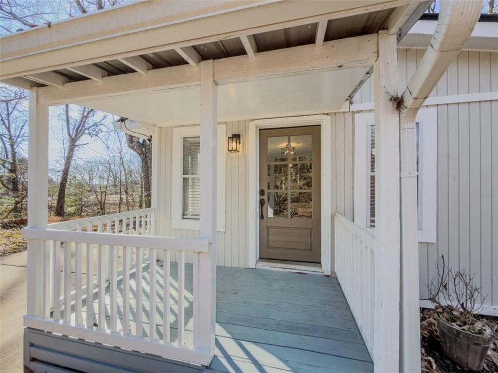 2317 Ford White Road Gainesville, GA 30506 - Photo 6 of 27 a view of a hallway with wooden floor and windows