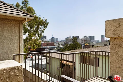 a view of a balcony with city view