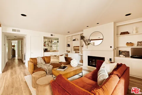 a living room with furniture a fireplace and a fireplace