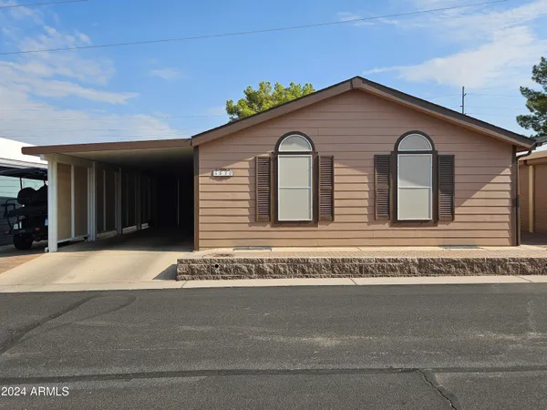 a front view of a house with a garage