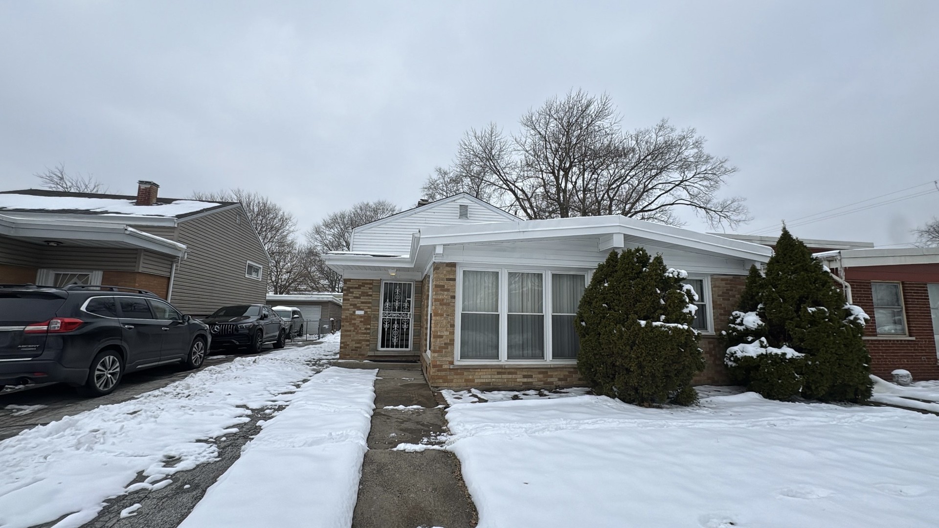 a view of a house with a stove and porch