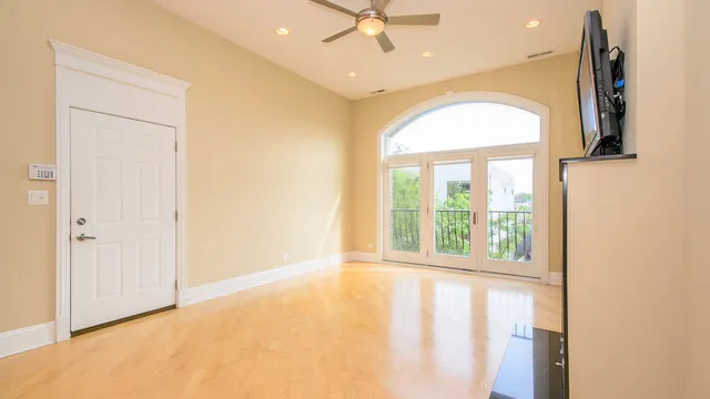 a view of a kitchen with kitchen island a counter top space a sink and appliances